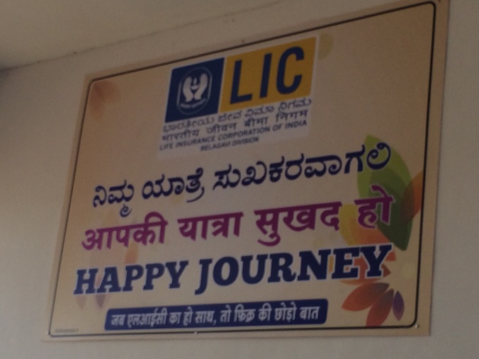 Sign at the Belgaum airport wishing us "Happy Journey". Found it ironic it was sponsored by the India Life Insurance Company. 